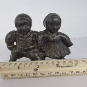 Vintage metal figurine of 2 Campbell's Kids